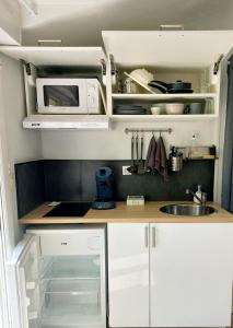 Kuchyň nebo kuchyňský kout v ubytování Studio cosy, terrasse privée - Arrivée autonome