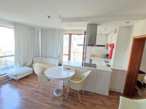 a kitchen and dining room with a table and chairs at Elegant, Suite, Swimming Pool in Wiesbaden