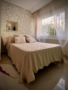 Posteľ alebo postele v izbe v ubytovaní Apartamento en Monte Gibralfaro piscina compartida