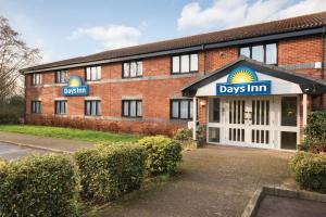a building with a sign on the front of it at Days Inn Michaelwood M5 in Falfield
