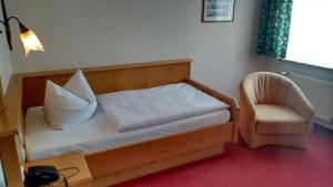Postel nebo postele na pokoji v ubytování Altstadt- und Businesshotel Pfaubräu - Brauereigasthof - Frühstücksbuffet - kostenfreie Radgarage - Hunde willkommen