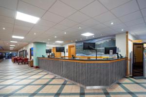 a lobby of a hospital with a reception counter at Coylumbridge Resort Hotel in Aviemore