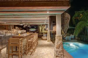 a resort with a swimming pool and a restaurant at Villa Mistral Montiboli by Buccara in Villajoyosa