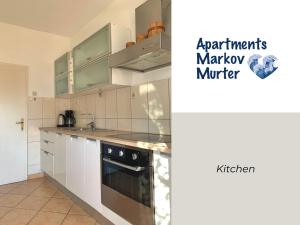 Kuchyň nebo kuchyňský kout v ubytování Apartments Markov Murter
