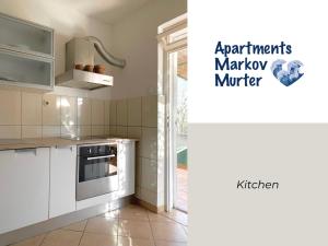 Kuchyň nebo kuchyňský kout v ubytování Apartments Markov Murter