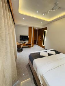 Postel nebo postele na pokoji v ubytování Hotel Royal Retreat