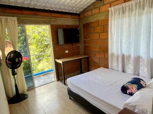 Postel nebo postele na pokoji v ubytování La Clarita + 8 fotografií