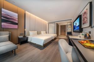 TV a/nebo společenská místnost v ubytování Atour Hotel Dazhou Quxian Wealth Center