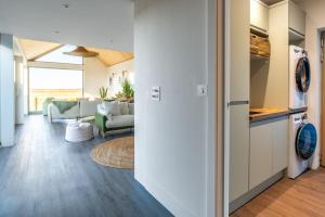 a hallway with a living room and a living room at The Ark 4 in Southwold