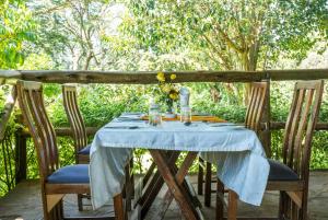 a table with a blue table cloth on top of it at Solio Gardens Nanyuki in Nanyuki