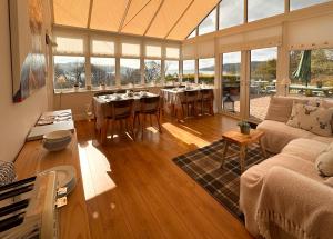 a living room with a couch and a table at The Tregortha B&B in Tighnabruaich