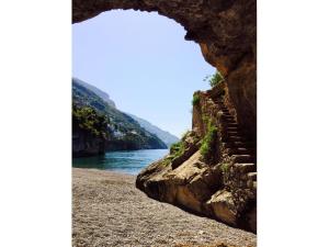 a view of a river from a rock cave at Torre Sponda - Cisterna, Private Beach in Positano