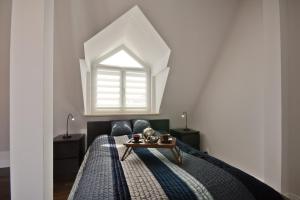 Łóżko lub łóżka w pokoju w obiekcie Imperial Apartments - Galeria
