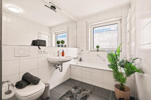 Koupelna v ubytování Oscar's City Apartment