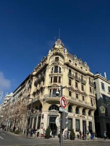 a large building on the corner of a street at casa de lucas in Caniles