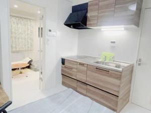 a kitchen with a sink and a stove at 花乃郷 板橋 in Tokyo +12 photos