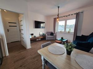 TV a/nebo společenská místnost v ubytování Apartament Danuta Mrągowo