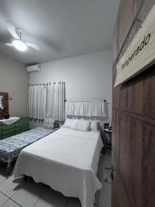 a bedroom with two beds in a room at HOTEL POUSADA MACHADO in Frutal +109 photos
