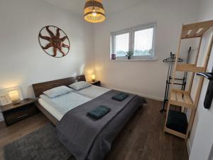 Postel nebo postele na pokoji v ubytování Apartament Danuta Mrągowo