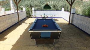 a ping pong table and a pool table at Casa Pino Solo in Iznájar