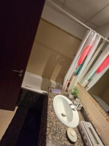 a bathroom with a sink and a shower at النزهة2 in Cairo