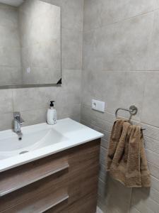 a bathroom with a sink and a mirror at La Casa de los Alemanes in Gaibiel +15 photos