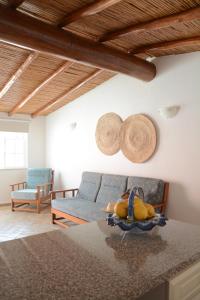 a living room with a blue couch with a stuffed animal at SOLAR DOS AVÓS in Guia
