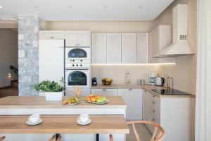 A kitchen or kitchenette at Seafront elegant villas, with infinity pools & devine views!