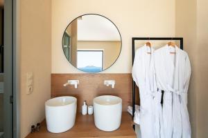 A bathroom at Seafront elegant villas, with infinity pools & devine views!