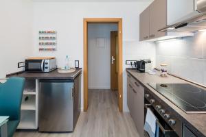 a kitchen with a counter top with a microwave at Ferienwohnung an der Volme in Meinerzhagen