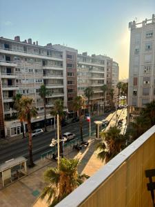 a view of a city street with tall buildings at Escapade Méditerrannéenne Appart' Cosy et Élégant in Toulon +37 photos