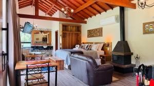 a bedroom with a bed and a wood stove at Villa Tirol - Monte Verde in Monte Verde