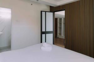 Rúm í herbergi á Rich Boutique Hotel
