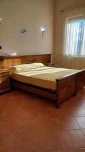 A bed or beds in a room at Uliveto Garden
