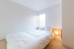 Postel nebo postele na pokoji v ubytování &AND HOSTEL AKIHABARA