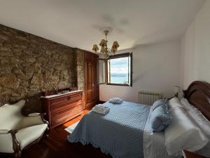 Postel nebo postele na pokoji v ubytování Casa Martorell Ferrol