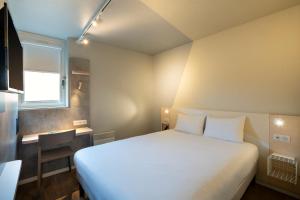 Postel nebo postele na pokoji v ubytování Ibis budget Brest Sud Plougastel - Hôtel rénové