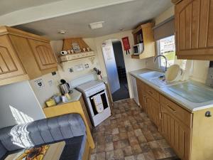 an aerial view of a kitchen in a caravan at The Hive on The Chase Ingoldmells in Skegness