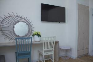 Sjónvarps- og/eða afþreyingartæki á Rich Boutique Hotel