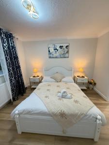 Postel nebo postele na pokoji v ubytování Flat in Surrey