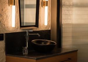 a bathroom with a bowl sink on a counter at Letoh Letoh Bilbao in Bilbao
