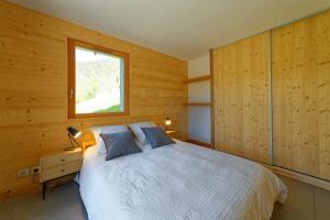 Postel nebo postele na pokoji v ubytování Logement 3 étoiles avec vue imprenable sur les montagnes, ski bus