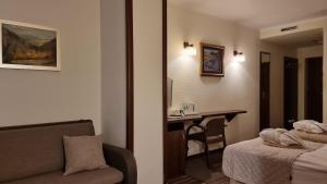 Postel nebo postele na pokoji v ubytování Hotel Nad Przełomem