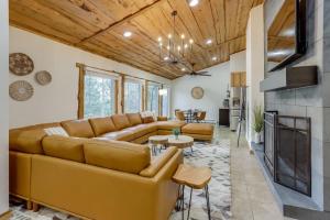 a living room with a couch and a fireplace at Mountain Mansion With A Hot Tub And A Sauna in Morrison