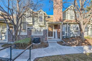 a brick house with a chimney at Pet Friendly Townhome WIth A Fireplace And A King Bed In Littleton in Littleton
