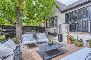a patio with chairs and a table and a tree at Guest Suite At Hilltop And Cherry Creek Near to Museums in Denver