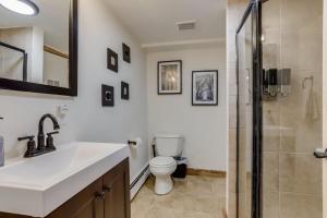 a bathroom with a toilet and a sink and a shower at Mountain Mansion With A Hot Tub And A Sauna in Morrison +47 photos