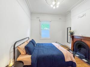Voodi või voodid majutusasutuse Flemington Escape with private rooftop area toas