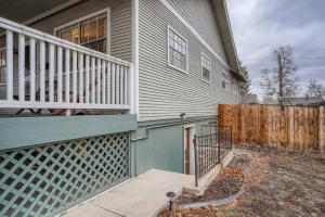 a house with a porch and a fence at Guest Suite In West Denver With A Full KItchen in Wheat Ridge