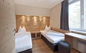 Postel nebo postele na pokoji v ubytování POP-UP LIVING Zell am See